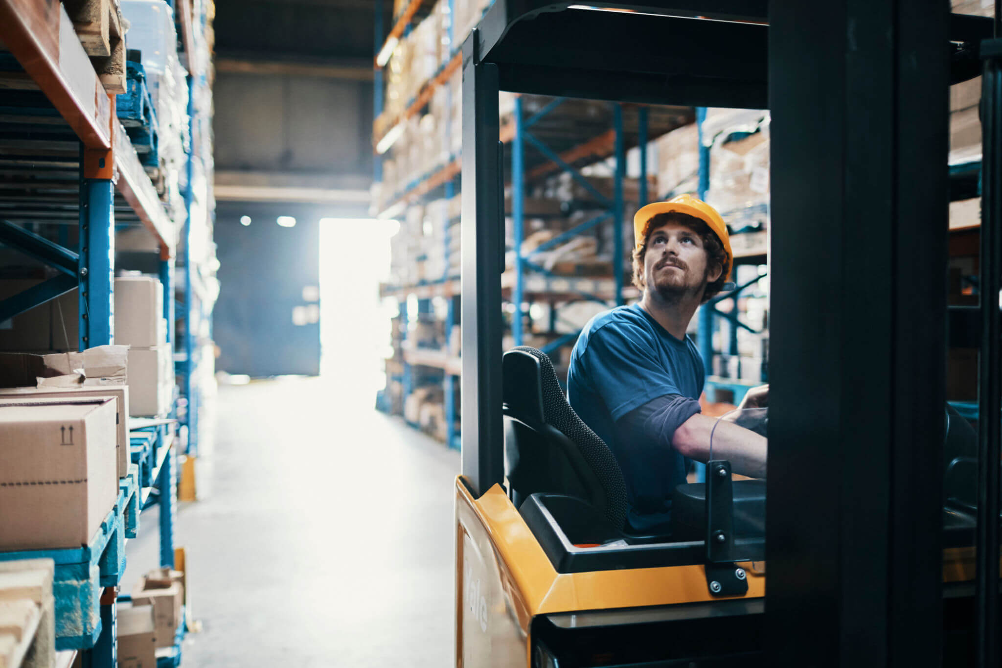 Man on a picker in a warehouse