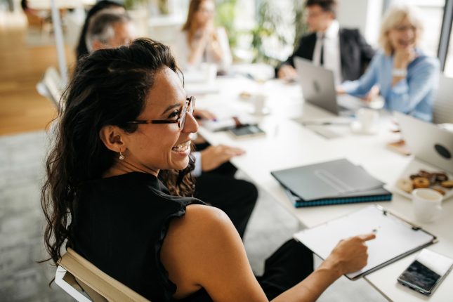 Candid Close-Up of Businesswoman in Office Meeting