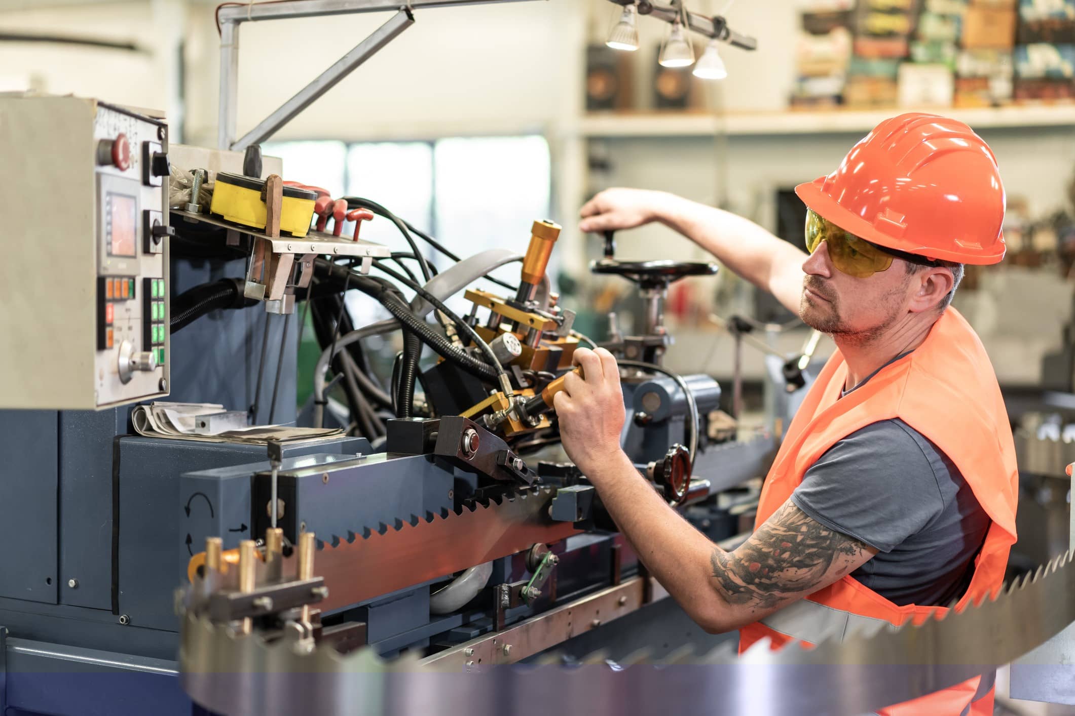 factory worker using machine equipment in factory workshop