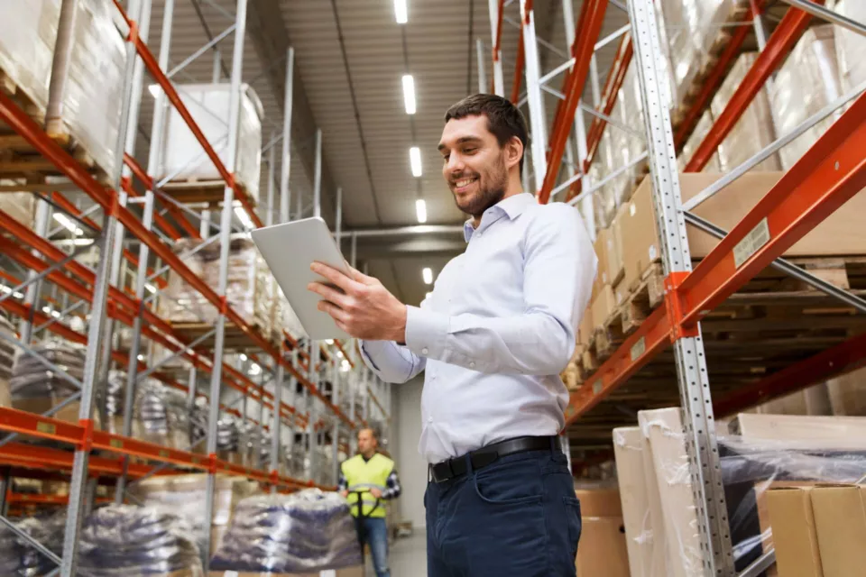 Supply chain businessman tablet warehouse