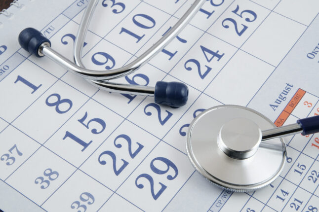 A calendar with a stethoscope placed on top to illustrate the critical role of effective CGT slot allocation for autolologous therapies